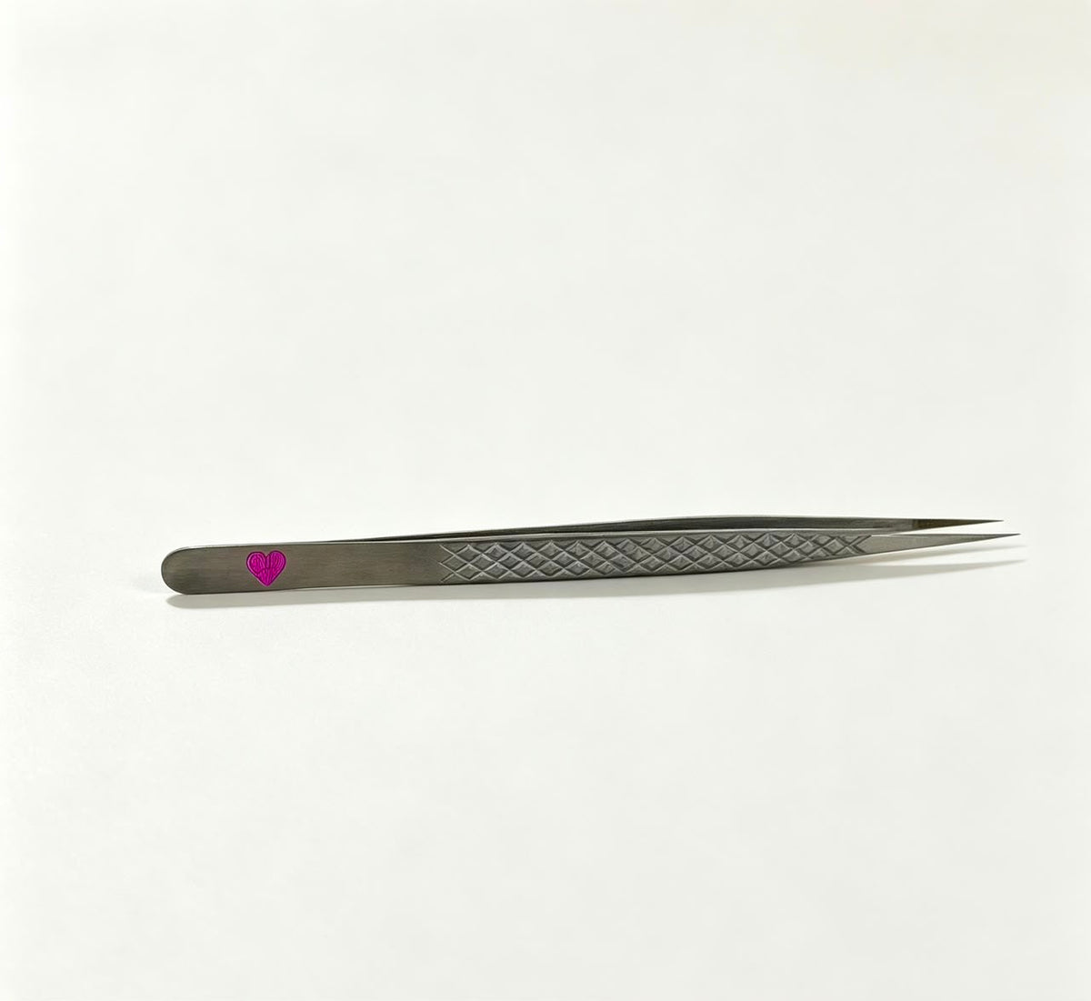 A straight isolation tweezer designed for precision\. The fine tip makes it easy to separate natural lashes, isolate cleanly, and reach different areas of the lash line throughout your service\.